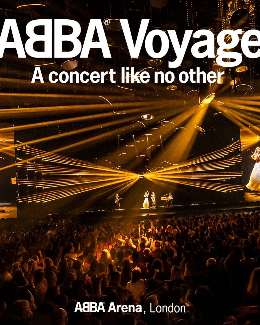 The ABBA Voyage stage at the ABBA Arena lit in gold with the show's title above - the official show image
