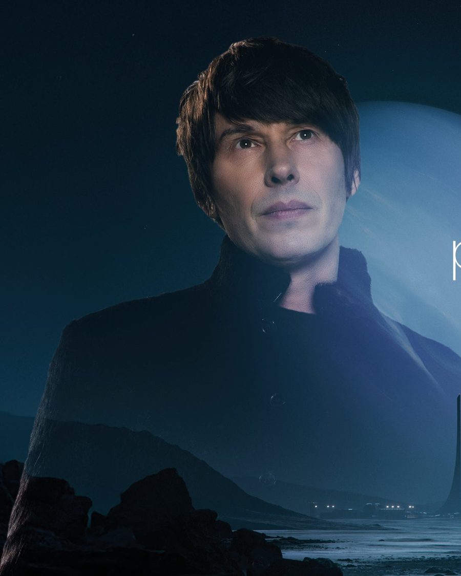 Professor Brian Cox against a night sky with a crescent planet, Emergence tour title beside him - the official tour image