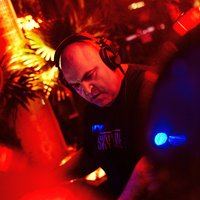 Anthony Pappa performing at the decks under coloured lights