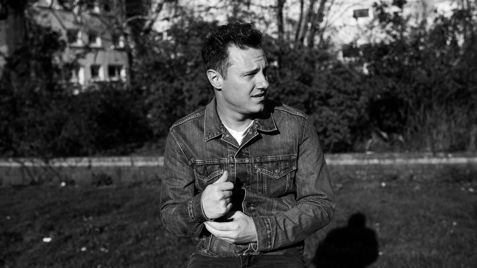A black-and-white portrait of Callum Beattie